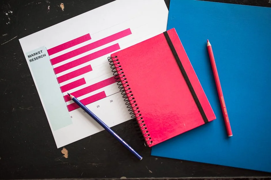 Planner open on a desk with handwritten Holiday Email Marketing Series note.